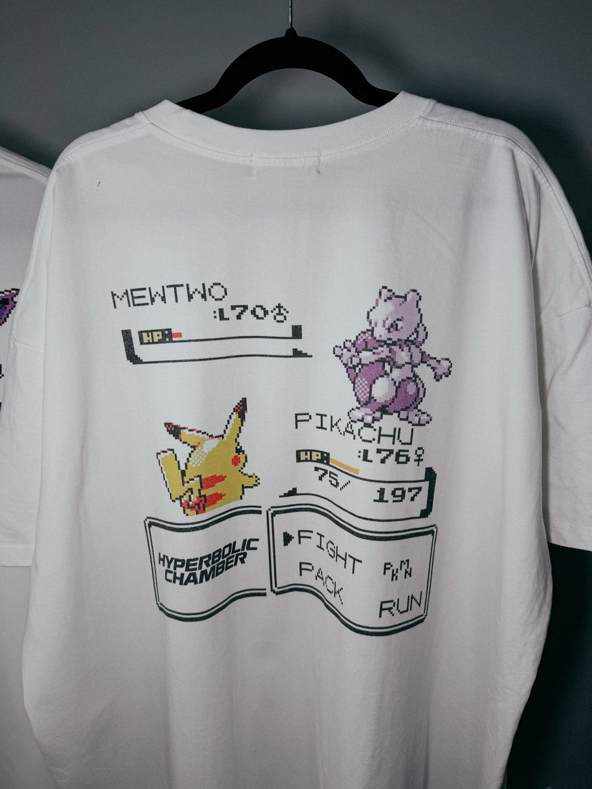 Pikachu vs Mewtwo pixel art oversized tee by Hyperbolic Chamber – view 1